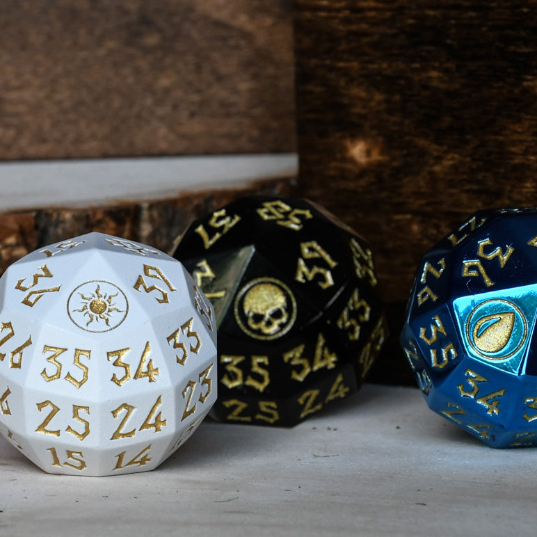 Three polyhedral dice with different designs on a wooden surface