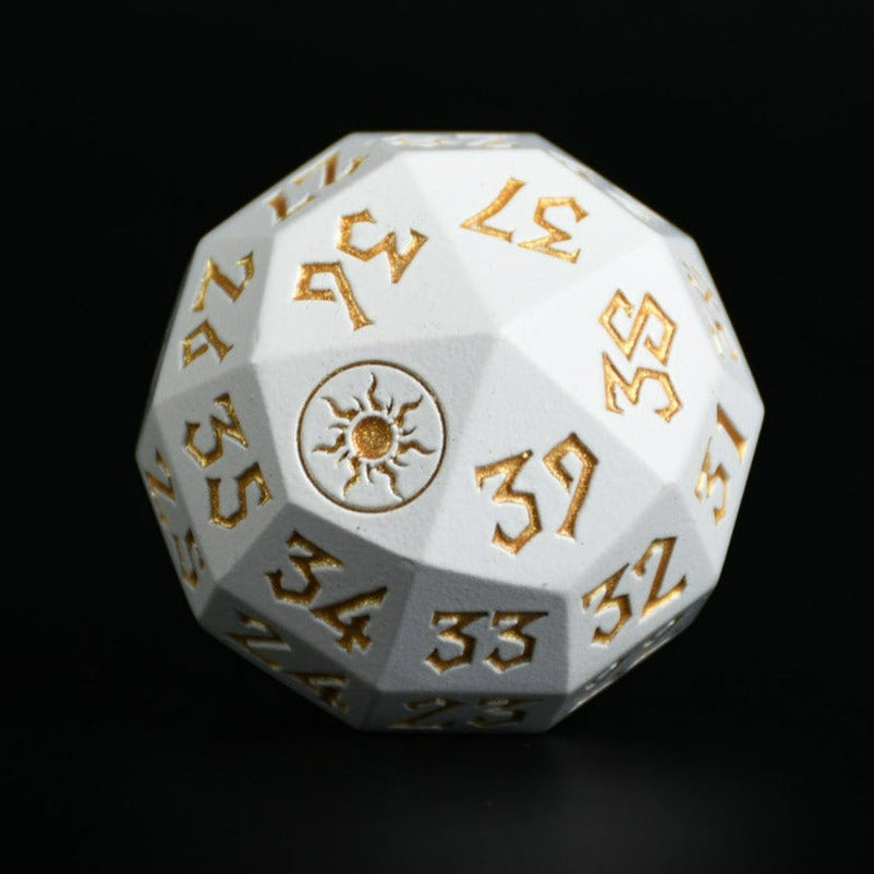 A silver metal d 40 dice with gold numbers and symbols, designed as a spindown life counter, placed on a wooden surface for magic the gathering and trading card games